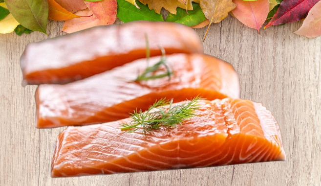 salmon fish on a cutting board removebg preview স্বাস্থ্যকর চুল ত্বক ও নখের জন্য 10টি ম্যাজিক খাবার,চুল পড়া রোধে খাবার,ত্বকের উজ্জ্বলতা বাড়াতে খাবার,নখ মজবুত করার খাবার,10 Magic Foods for Healthy Hair Skin and Nails